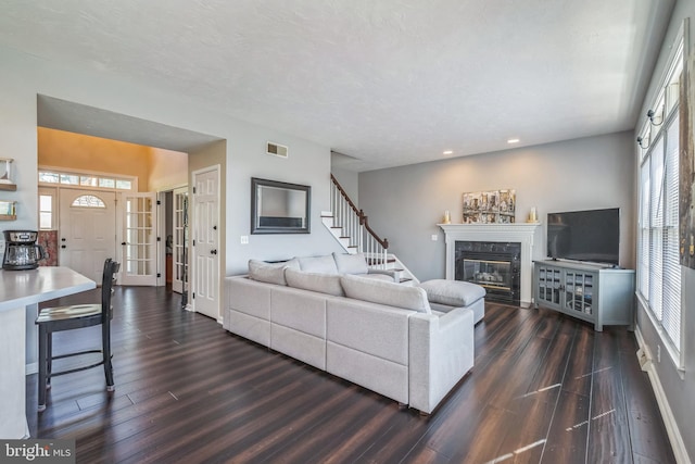 1012 Woodridge Rd, Red Lion, PA 17356 - living room with dark wood-style flooring, a premium fireplace, recessed lighting, and stairway