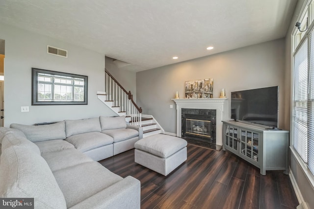 1012 Woodridge Rd, Red Lion, PA 17356 - living room featuring recessed lighting, dark wood-type flooring, a fireplace, and stairway