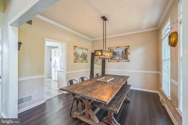 1012 Woodridge Rd, Red Lion, PA 17356 - dining area with dark wood-type flooring, ornamental molding, and a chandelier