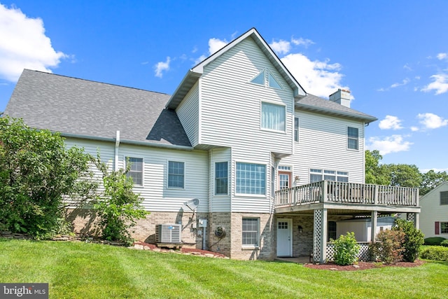 1012 Woodridge Rd, Red Lion, PA 17356 - back of property with a wooden deck, a lawn, a chimney, and roof with shingles