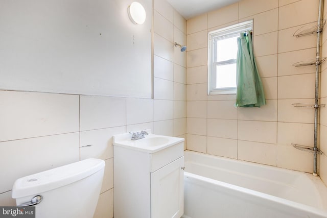 627 Forrester St SE, Washington, DC 20032 - full bathroom with tile walls, vanity, and washtub / shower combination