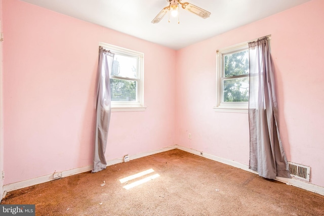 627 Forrester St SE, Washington, DC 20032 - carpeted empty room with healthy amount of natural light and ceiling fan