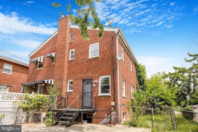 627 Forrester St SE, Washington, DC 20032 - view of front of home featuring brick siding and a chimney