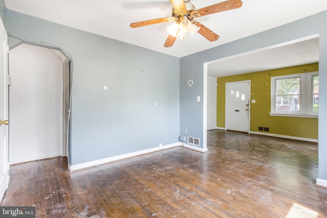 627 Forrester St SE, Washington, DC 20032 - unfurnished room with hardwood / wood-style floors, arched walkways, and a ceiling fan