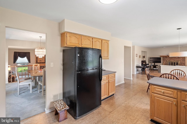 28 Amherst Way, West Windsor, NJ 08550 - kitchen with freestanding refrigerator, dark countertops, pendant lighting, and a chandelier