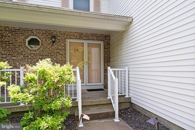 28 Amherst Way, West Windsor, NJ 08550 - view of exterior entry featuring brick siding