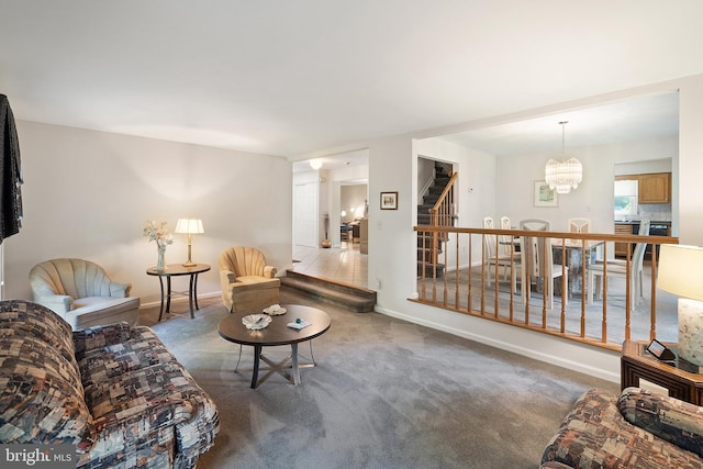 28 Amherst Way, West Windsor, NJ 08550 - living room with stairway, a chandelier, and carpet floors