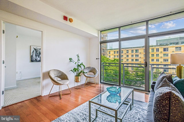 475 K St NW Unit 630, Washington, DC 20001 - living area with wood finished floors and floor to ceiling windows