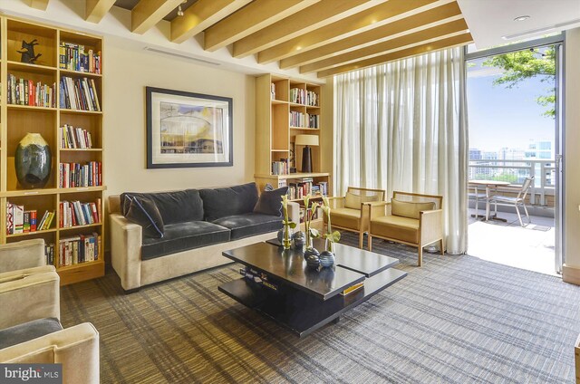 475 K St NW Unit 630, Washington, DC 20001 - carpeted living area with a wall of windows and beam ceiling