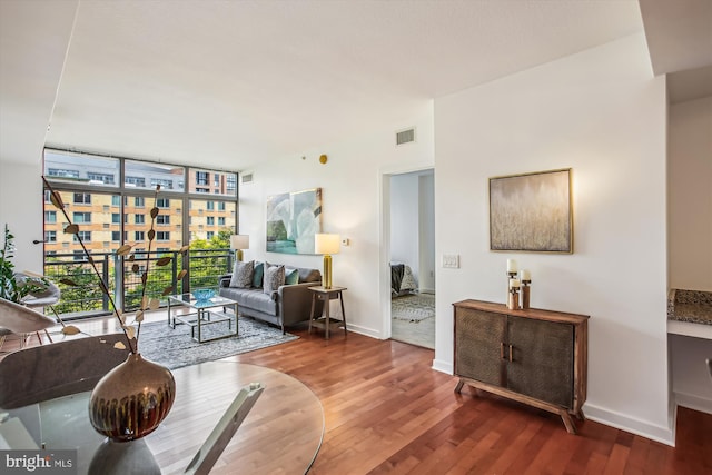 475 K St NW Unit 630, Washington, DC 20001 - living area with a wall of windows and wood finished floors