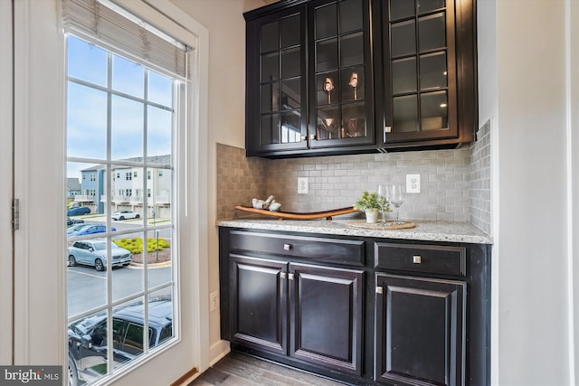 18004 Red Cedar Rd, Dumfries, VA 22026 - bar featuring decorative backsplash and light wood finished floors