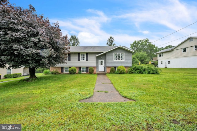 23 Maple St, Ashland, PA 17921 - split foyer home with a front yard and brick siding