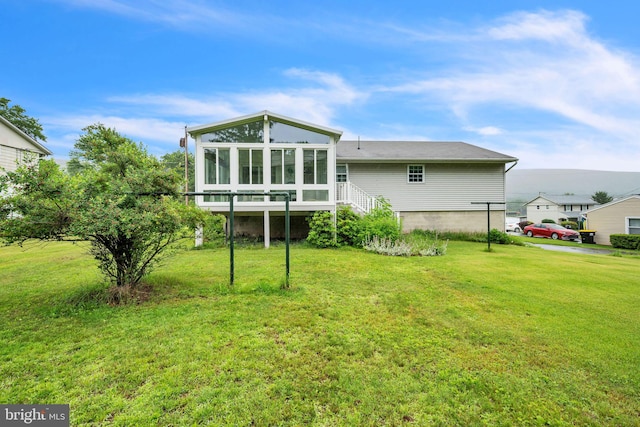 23 Maple St, Ashland, PA 17921 - back of property featuring a sunroom and a yard