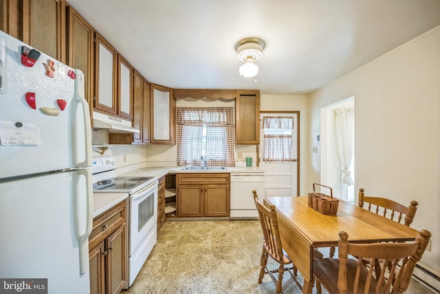 23 Maple St, Ashland, PA 17921 - kitchen with white appliances, under cabinet range hood, light countertops, and brown cabinets