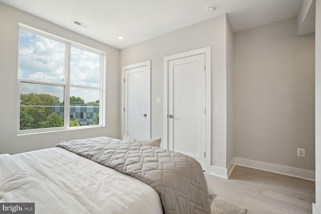 901 19th St NE Unit Ph2, Washington, DC 20002 - bedroom with light wood-type flooring and recessed lighting