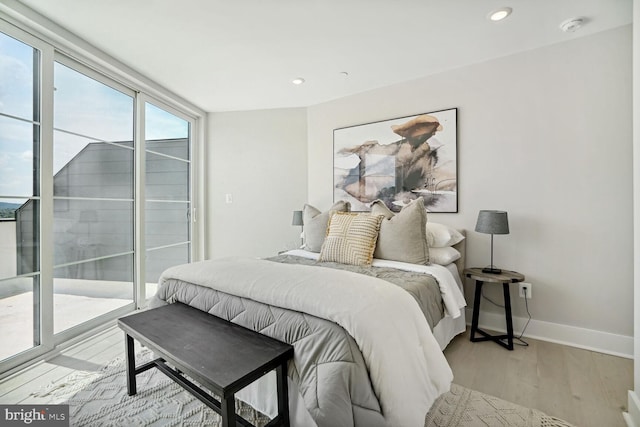901 19th St NE Unit Ph2, Washington, DC 20002 - bedroom featuring light wood-style flooring, recessed lighting, and access to outside