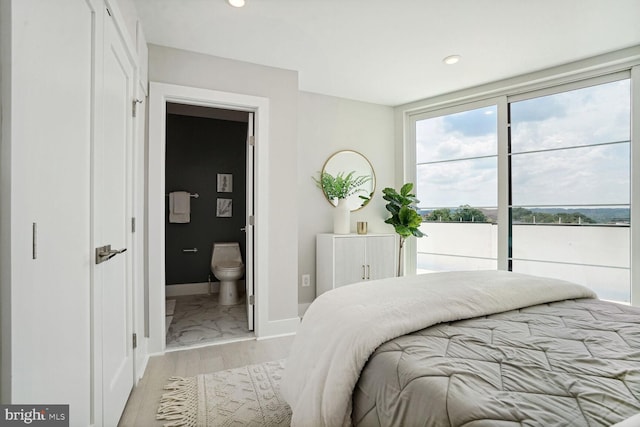 901 19th St NE Unit Ph2, Washington, DC 20002 - bedroom with connected bathroom, recessed lighting, and light marble finish flooring
