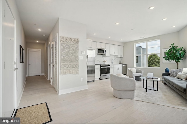 901 19th St NE Unit Ph2, Washington, DC 20002 - living room with light wood-style flooring and recessed lighting