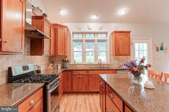 10 Elser Hill Rd, Lititz, PA 17543 - kitchen with stainless steel range with gas stovetop, wall chimney range hood, healthy amount of natural light, brown cabinetry, and recessed lighting