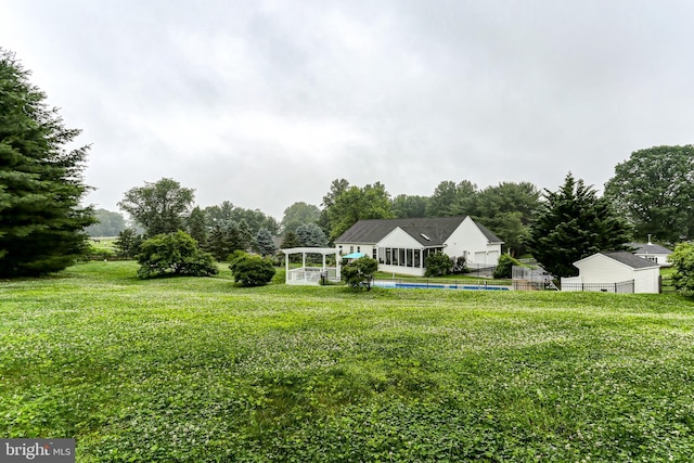 10 Elser Hill Rd, Lititz, PA 17543 - view of front of home with an outdoor pool, a front lawn, and view of wooded area