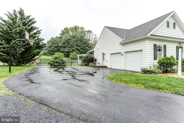 10 Elser Hill Rd, Lititz, PA 17543 - view of side of property with driveway, roof with shingles, and an attached garage