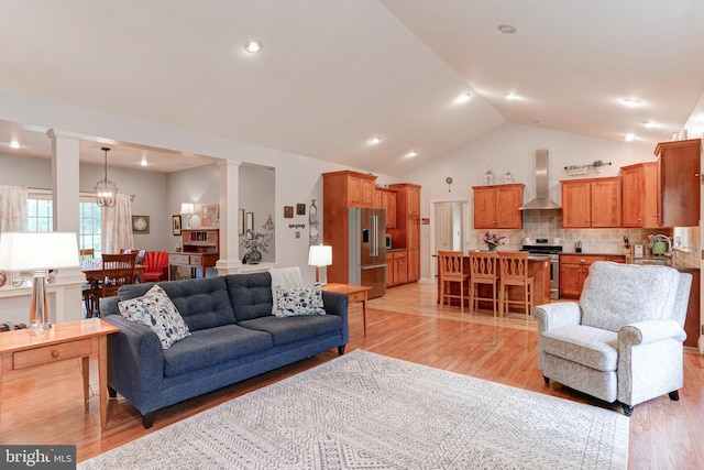 10 Elser Hill Rd, Lititz, PA 17543 - living room featuring ornate columns, light wood-style floors, vaulted ceiling, and recessed lighting