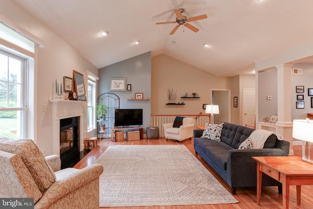 10 Elser Hill Rd, Lititz, PA 17543 - living room featuring light wood-type flooring, a ceiling fan, a fireplace with flush hearth, lofted ceiling, and ornate columns