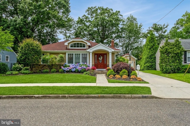 240 Meadow Dr, Haddonfield, NJ 08033 - view of front of house featuring a front yard and a chimney