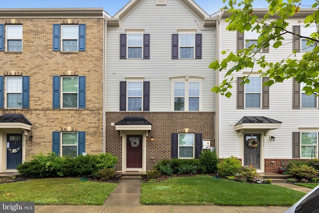 10020 Sandy Run, Baltimore, MD 21220 - view of property with brick siding and a front lawn