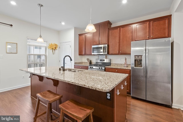 10020 Sandy Run, Baltimore, MD 21220 - kitchen featuring appliances with stainless steel finishes, dark wood-type flooring, recessed lighting, an island with sink, and a kitchen breakfast bar