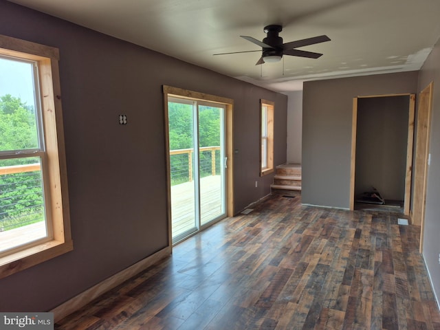 487 Haps Dr, Benezette, PA 15821 - spare room featuring dark wood-type flooring, stairway, and a ceiling fan