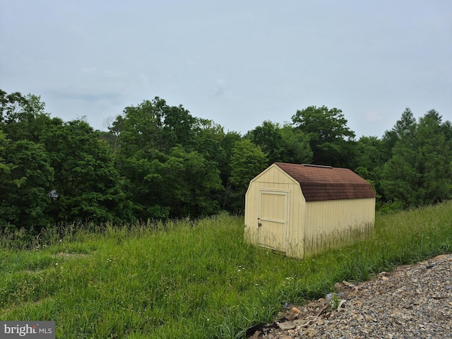 487 Haps Dr, Benezette, PA 15821 - view of shed featuring a wooded view