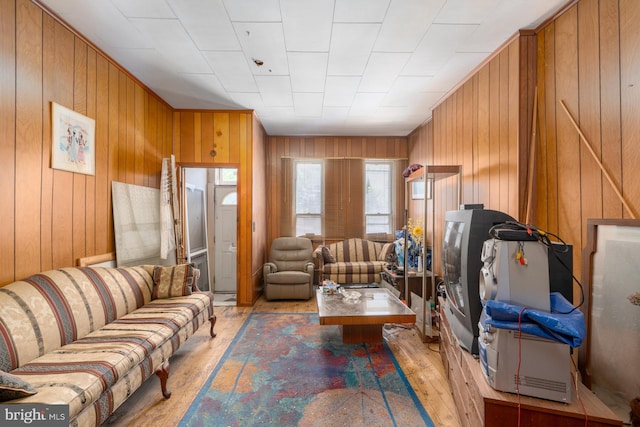 2560 W Fairmount Ave, Baltimore, MD 21223 - living room featuring light wood finished floors and wooden walls