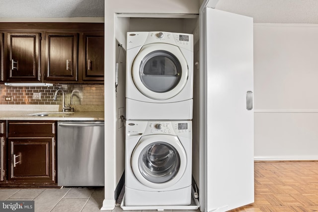 4100 N Charles St N Unit 803, Baltimore, MD 21218 - laundry area featuring estacked washer and dryer and ornamental molding