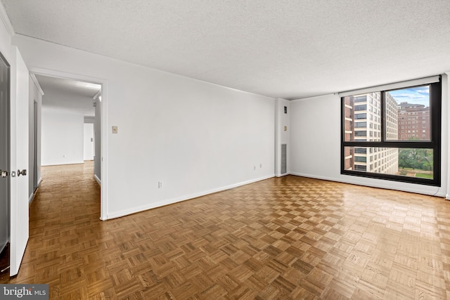 4100 N Charles St N Unit 803, Baltimore, MD 21218 - spare room featuring a textured ceiling and baseboards
