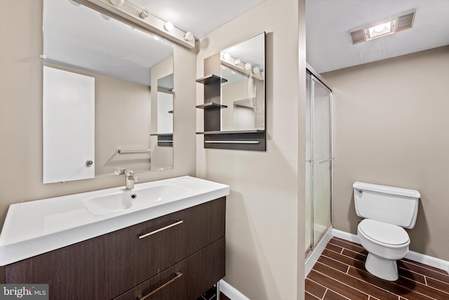 4100 N Charles St N Unit 803, Baltimore, MD 21218 - bathroom with vanity, a stall shower, and wood finish floors