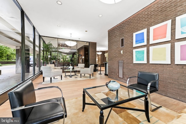 4100 N Charles St N Unit 803, Baltimore, MD 21218 - community lobby with brick wall, floor to ceiling windows, and recessed lighting