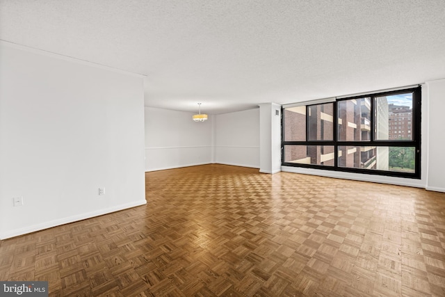 4100 N Charles St N Unit 803, Baltimore, MD 21218 - spare room with a textured ceiling and a chandelier