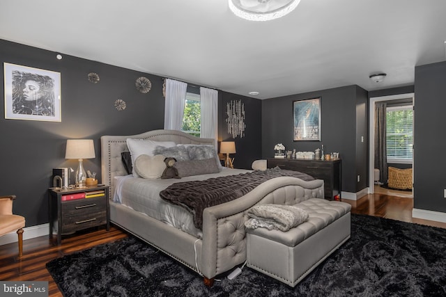 18424 Horseshoe Bend Rd, Sharpsburg, MD 21782 - bedroom featuring dark wood-style floors, multiple windows, and an accent wall