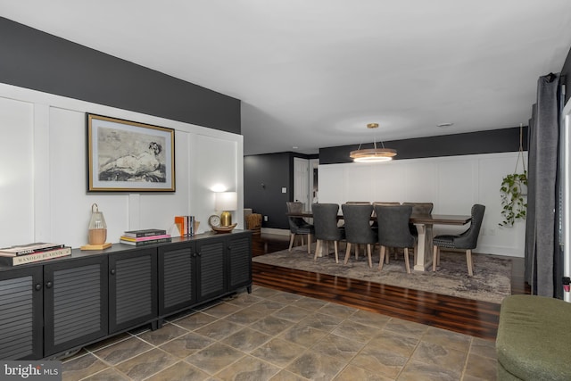 18424 Horseshoe Bend Rd, Sharpsburg, MD 21782 - dining space with stone finish flooring and a decorative wall