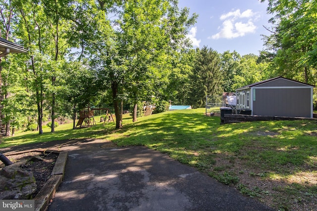 18424 Horseshoe Bend Rd, Sharpsburg, MD 21782 - view of green lawn featuring a playground and view of scattered trees