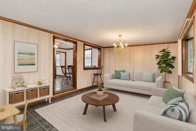 715 Griffith Rd, Glen Burnie, MD 21061 - living room with ornamental molding, a chandelier, and wooden walls