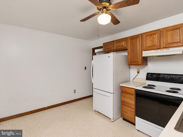 715 Griffith Rd, Glen Burnie, MD 21061 - kitchen with electric range, under cabinet range hood, freestanding refrigerator, brown cabinets, and light floors