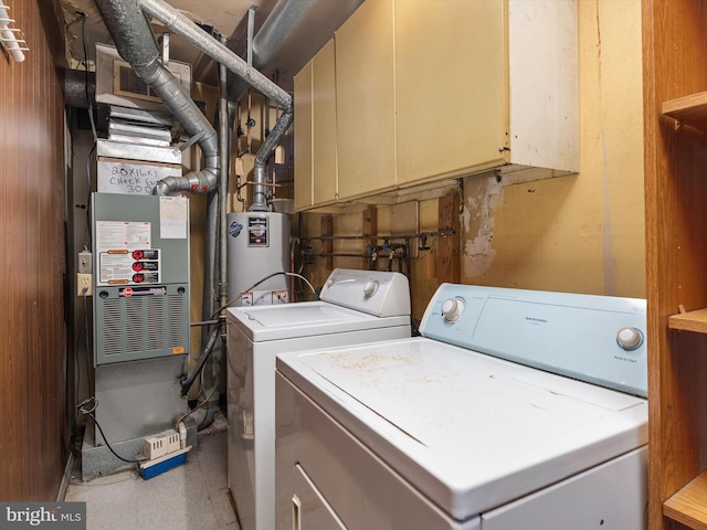 715 Griffith Rd, Glen Burnie, MD 21061 - washroom with separate washer and dryer, cabinet space, and gas water heater