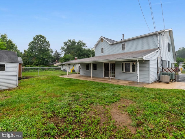 715 Griffith Rd, Glen Burnie, MD 21061 - rear view of house featuring a patio, a fenced backyard, a gate, and a storage shed