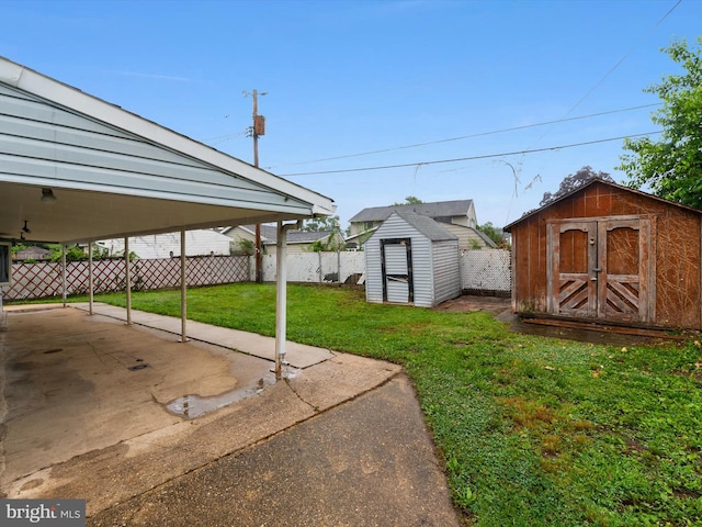 715 Griffith Rd, Glen Burnie, MD 21061 - view of yard featuring a storage unit and a carport