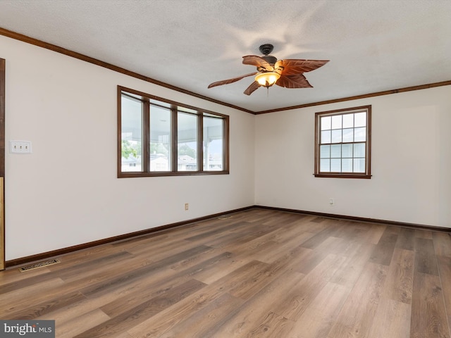 715 Griffith Rd, Glen Burnie, MD 21061 - empty room with ornamental molding, ceiling fan, wood finished floors, and a textured ceiling