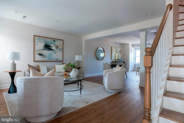 1616 C St NE, Washington, DC 20002 - living area featuring stairway, wood finished floors, and ornate columns