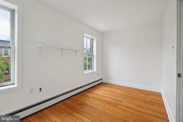 2016 Christian St Unit C, Philadelphia, PA 19146 - spare room featuring a baseboard radiator and light wood-style flooring