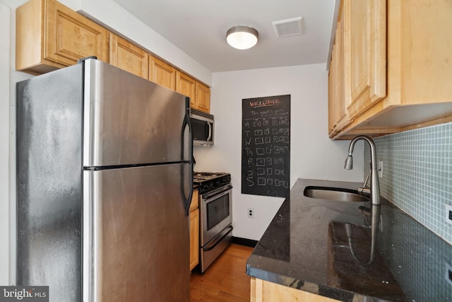 2016 Christian St Unit C, Philadelphia, PA 19146 - kitchen with appliances with stainless steel finishes, light wood-style floors, and dark stone countertops